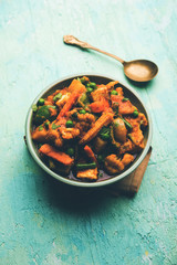 Mix vegetable curry - Indian main course recipe contains Carrots, cauliflower, green peas and beans, baby corn, capsicum and paneer/cottage cheese with traditional masala and curry, selective focus