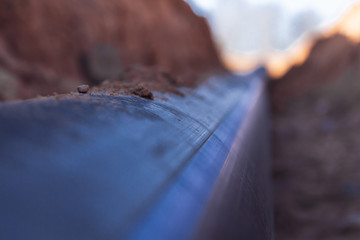 Plastic water pipe lay in a trench