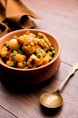 Mix vegetable curry - Indian main course recipe contains Carrots, cauliflower, green peas and beans, baby corn, capsicum and paneer/cottage cheese with traditional masala and curry, selective focus