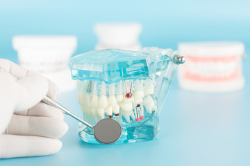 Dental tool with model in dental care concept.