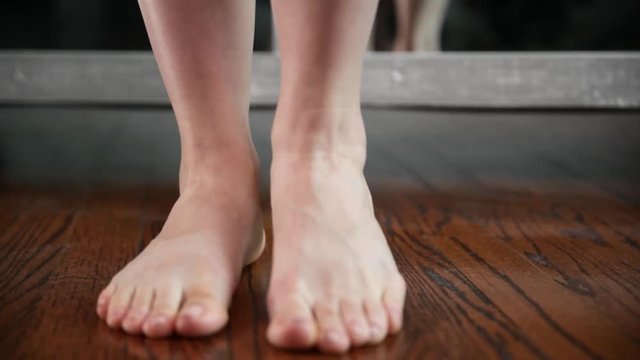 Woman shows her feet, legs and ankles after peeling