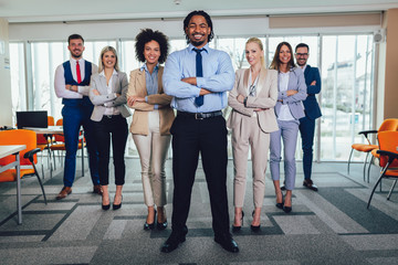 Group of happy business people and company staff in modern office, representig company.Selective focus.