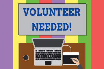 Text sign showing Volunteer Needed. Business photo text need work for organization without being paid Upper view laptop wooden desk worker drawing tablet coffee cup office