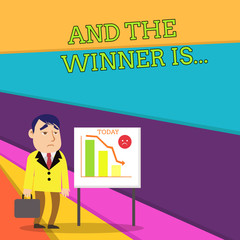 Handwriting text And The Winner Is. Conceptual photo announcing a demonstrating or thing that wins something Businessman Clerk with Brief Case Standing Whiteboard Declining Bar Chart