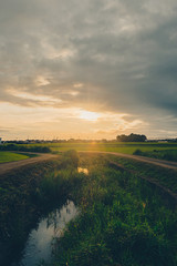 Obraz premium Orange sun and small river