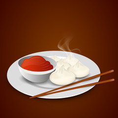 Momos with chopstick and sause.