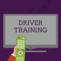 Word writing text Driver Training. Business photo showcasing prepares a new driver to obtain a driver s is license Hand Holding Computer Remote Control infront of Blank Wide Color PC Screen