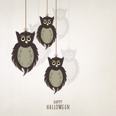 Halloween party celebration with hanging scary owl.