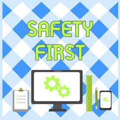 Conceptual hand writing showing Safety First. Concept meaning used to say that the most important thing is to be safe Business Concept PC Monitor Mobile Device Clipboard Ruler
