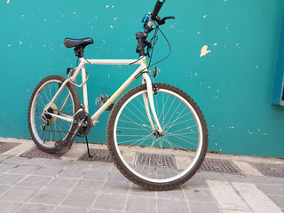 Fototapeta na wymiar bike on green wall feet