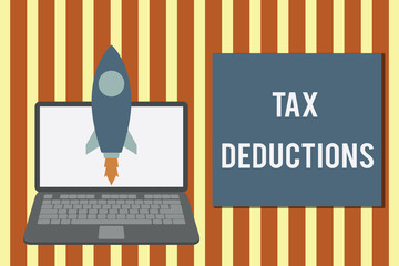 Writing note showing Tax Deductions. Business concept for an amount or cost that subtracted from someone s is income Launching rocket up laptop Startup Developing goal objective