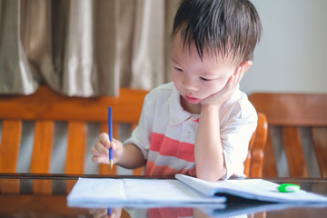 Cute Asian 3 - 4 years old toddler boy child writing / drawing with pencil, Student doing homework, Little kid prepare for kindergarten test, Creative play for toddler, improve focus in child concept