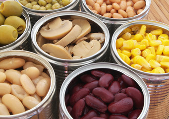 Canned food background, champignons, olives, beans, peas, corn