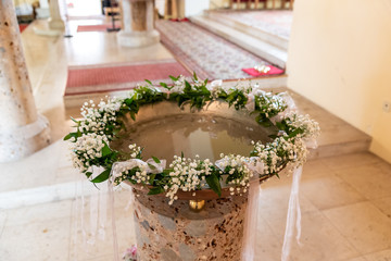 Baptism font with floral decoration
