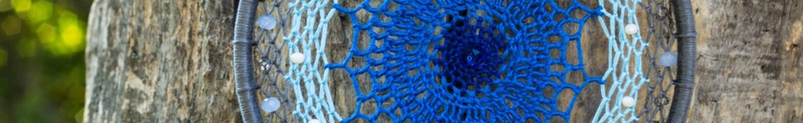 Banner of Handmade dream catcher with feathers threads and beads rope hanging