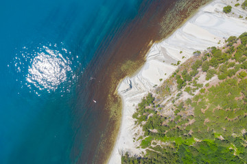 Fototapeta na wymiar Aerial View Of Black Sea Coastline With Wild Beach And Sun Reflection On Water, Gelendzhik, Russia