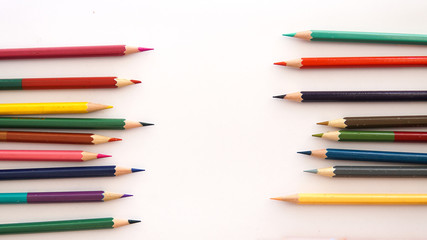 colored pencils on white background with copy space