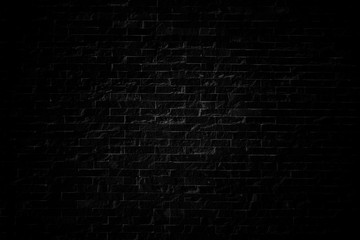 Background and texture black brick stone cladding wall.