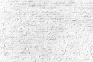 Background and texture white brick stone cladding wall.