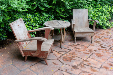 Antique set of wooden chairs and table vintage retro style with green natural background interior decoration contemporary