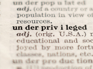 Fototapeta premium Dictionary definition of word underprivileged, selective focus.