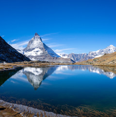 Naklejka premium Reflection of Riffelsee and Matterhorn mountain in Switzerland
