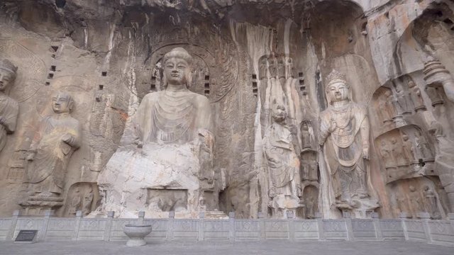 Panorama of the giant buddhist sculptures in the main Longmen Grotto (Fengxian Cave). Chinese Buddhist and finest art Longmen Caves, Luoyang, Henan province, China