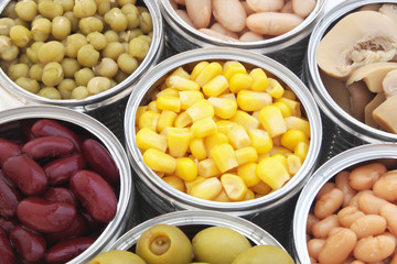 Canned food background, champignons, olives, beans, peas, corn
