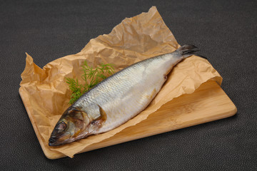 Salted herring over the wooden board