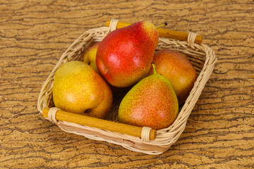 Pear heap in the wooden basket