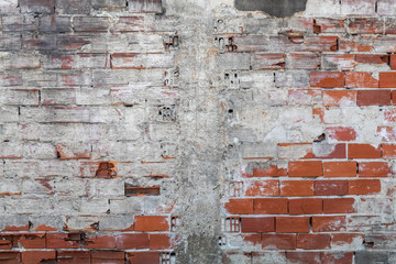 Old Weathered Concrete Decay Wall Texture With a Few Red Bricks Visible