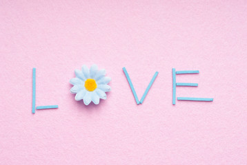 The word LOVE on a pink background