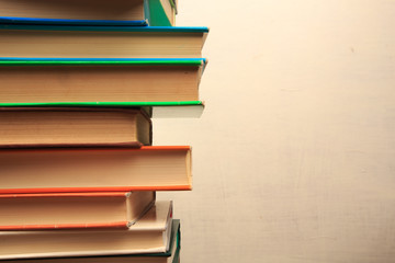Book stack in the library room and blurred bookshelf for business and education background, back to...