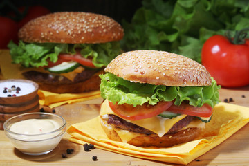 Two fresh hamburgers with vegetables	