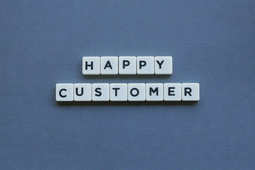 ' Happy Customer ' word made of square letter word on grey background.