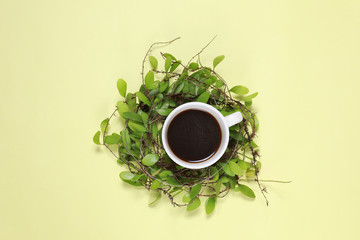 cup of tea with leaves on white background