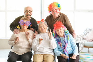 Happy senior people spending time together in nursing home