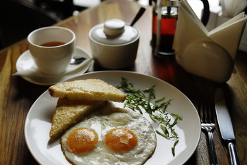 breakfast with fried eggs and bacon