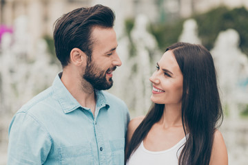 Fototapeta premium Phoro of two millennial spouses married look feel rejoice free time weekend holiday rest relax vacation wear shirt denim jeans blue singlet outdoors park nature bearded