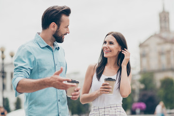 Portrait of excited students spring people have fun promenade bearded cite outside hold hand mug...