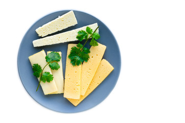 Sliced parsley cheese spread on a gray plate on a white background.