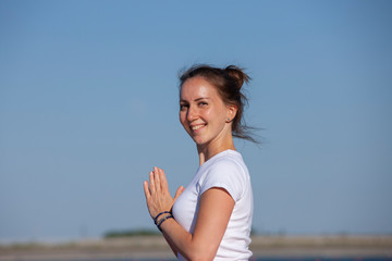 Fototapeta na wymiar Pilates yoga workout exercise outdoor in the lake pier