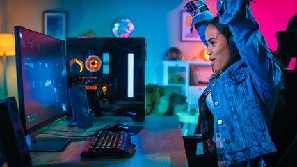 Pretty and Excited Black Gamer Girl in Headphones is Winning in First-Person Shooter Online Video...