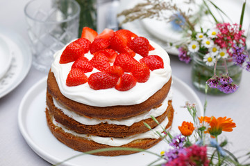 Scandinavian midsummer feast with strawberry cake