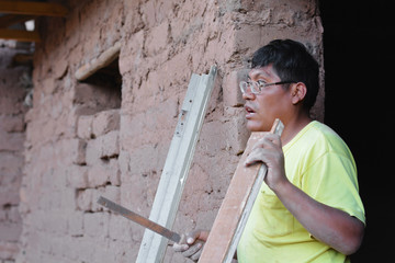 Serious native american worker in the countryside.
