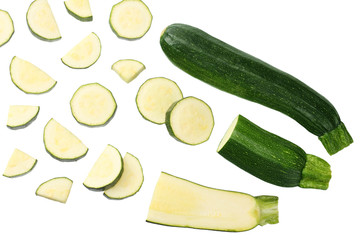 fresh green zucchini with slices isolated on white background. top view