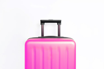 Suitcase on light pink background with place for text. Minimal creative travel concept	