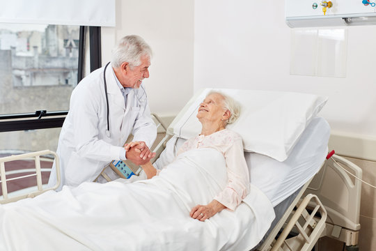 Caring doctor in conversation with senior citizen