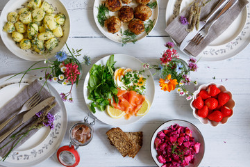 Scandinavian midsummer feast with potato salad, meatballs, salmon and beetroot - obrazy, fototapety, plakaty