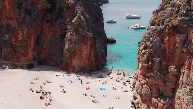 aerial drone island beach summer paradise vacation Torent de Pareis Sa Calobra Mallorca Spain